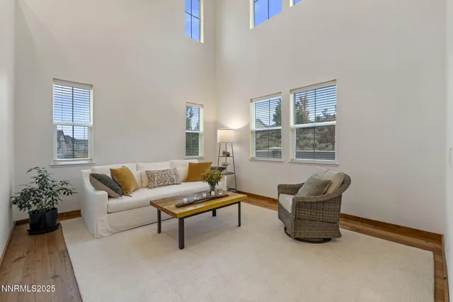 a living room with furniture and windows
