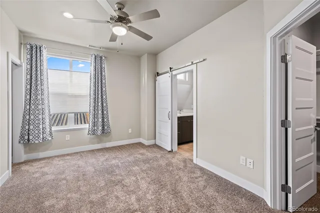 a bathroom with a sink toilet and a mirror