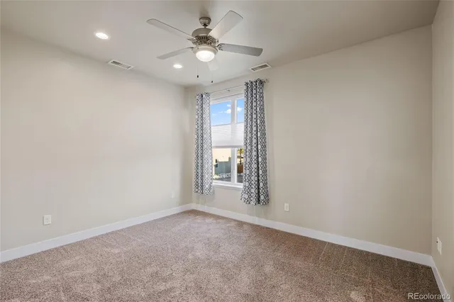 a kitchen with stainless steel appliances kitchen island granite countertop a refrigerator and a stove top oven