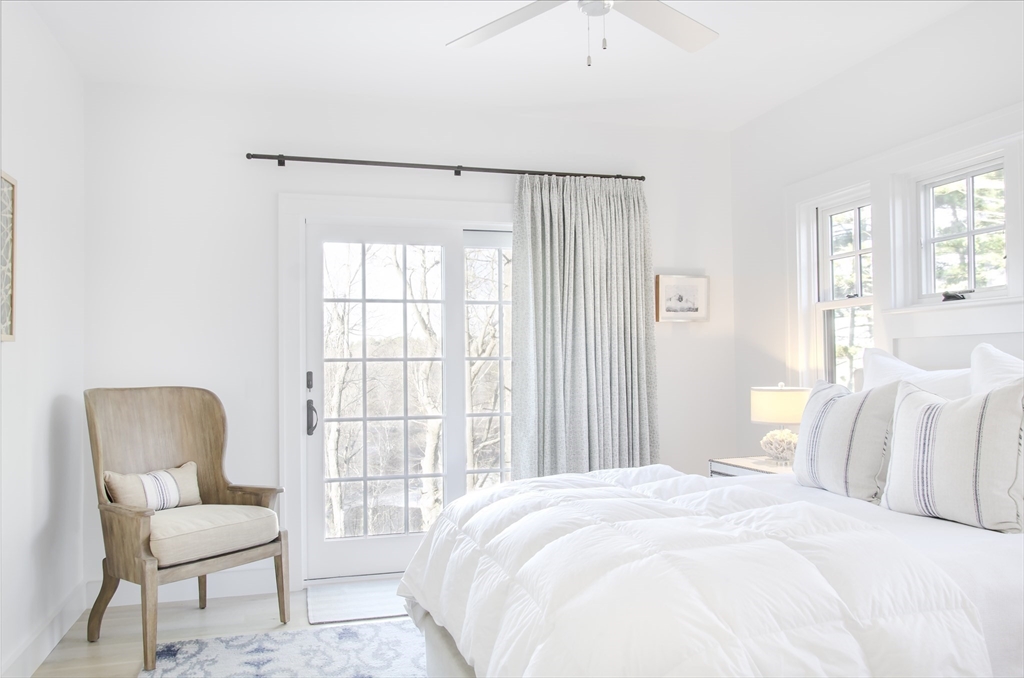 695 Summer Street Marshfield, MA 02050 - Photo 14 of 35 a bedroom with a bed and a chair