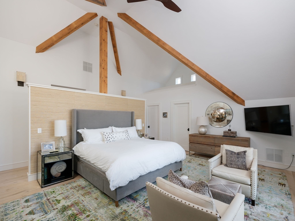 695 Summer Street Marshfield, MA 02050 - Photo 16 of 35 a bedroom with a bed window and a flat screen tv