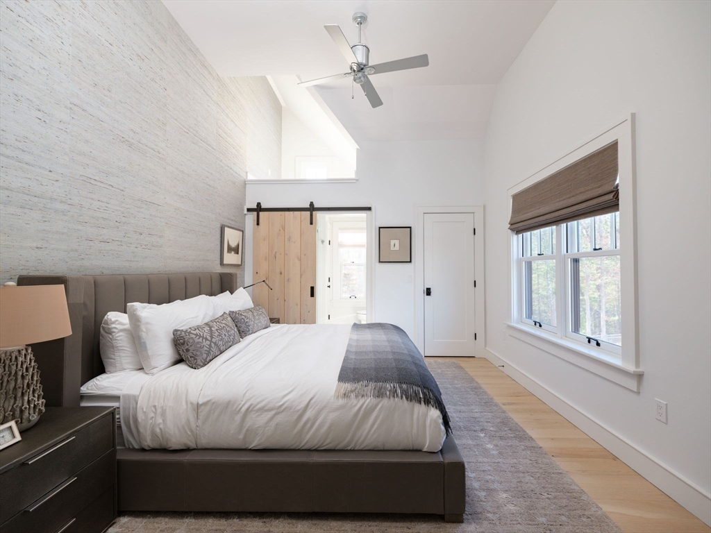 695 Summer Street Marshfield, MA 02050 - Photo 18 of 35 a spacious bedroom with a bed and a window