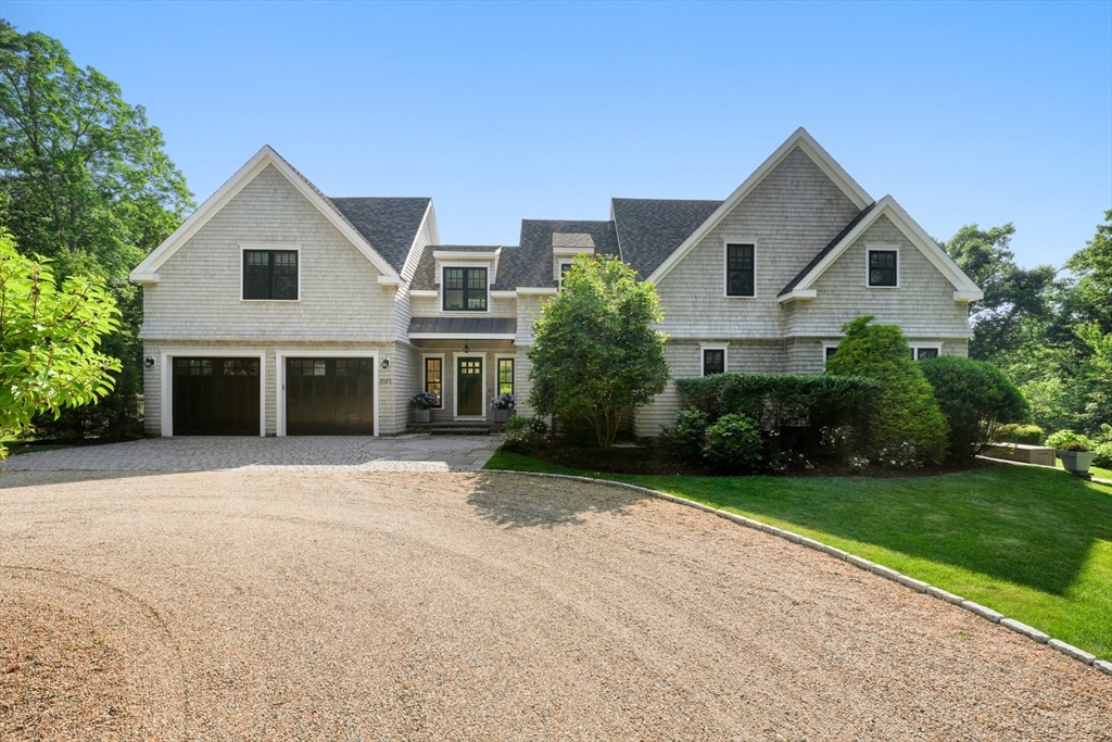 695 Summer Street Marshfield, MA 02050 - Photo 2 of 35 a front view of a house with a yard and garage