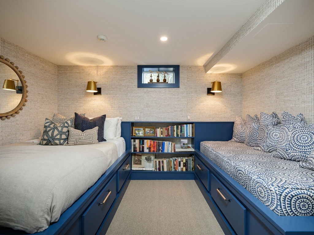 695 Summer Street Marshfield, MA 02050 - Photo 23 of 35 a bedroom with bed and a book shelf