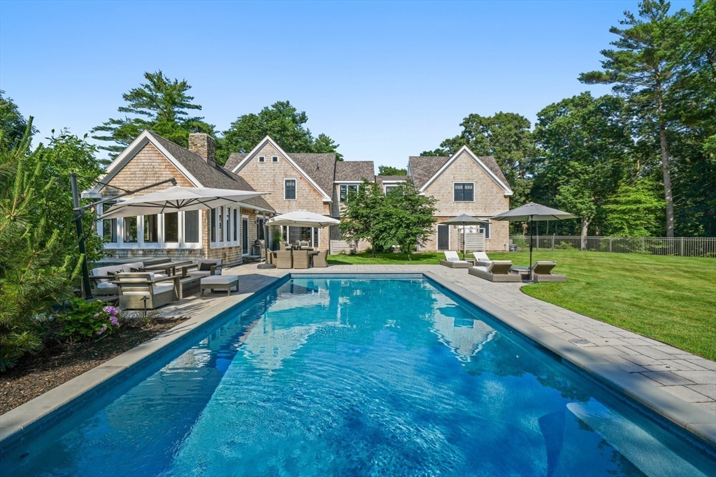 695 Summer Street Marshfield, MA 02050 - Photo 27 of 35 a house with swimming pool in front of it