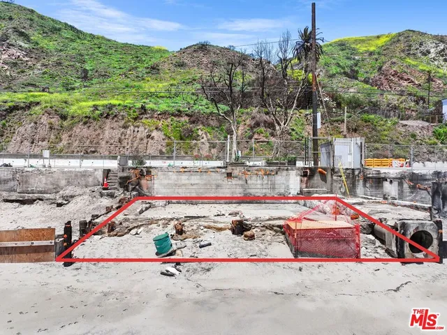 a view of a town with mountains in the background