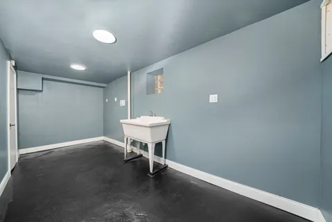 a view of a room with a table and chairs