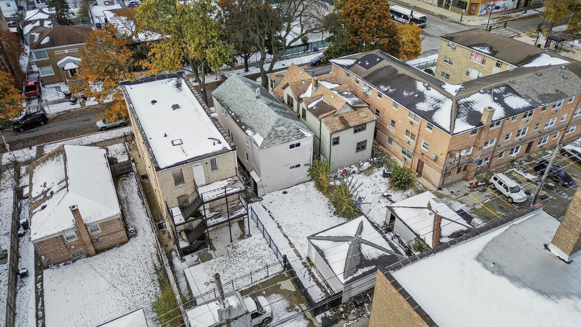 7917 South Ellis Avenue Chicago, IL 60619 - Photo 3 of 33 an aerial view of a residential apartment building with a yard
