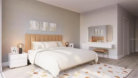 a bedroom with a bed and a table