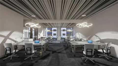 a view of a dining room with furniture wooden floor and chandelier