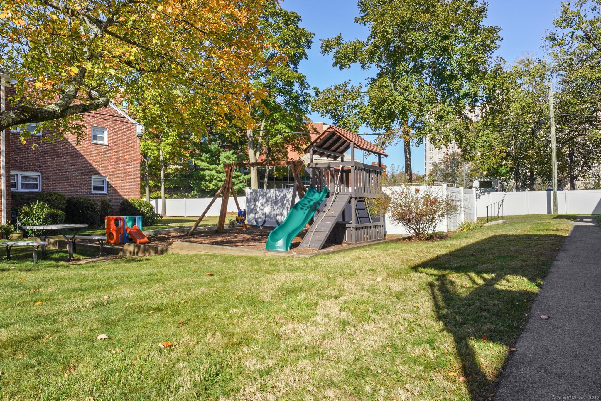 108 Strawberry Hill Avenue, Unit 1 Stamford, CT 06902 - Photo 17 of 20 a view of a park with swings and slides