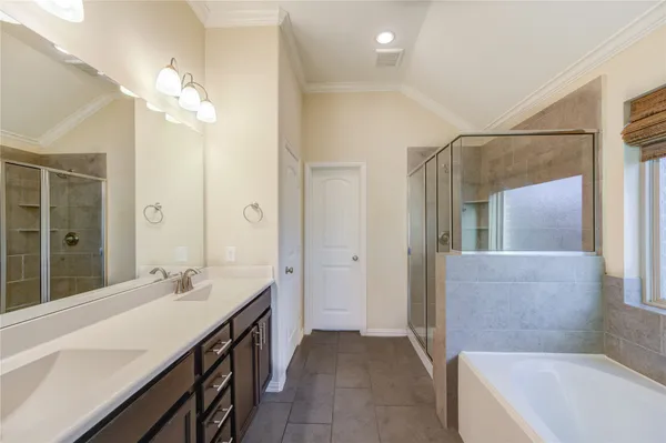 a bathroom with a bathtub and a shower