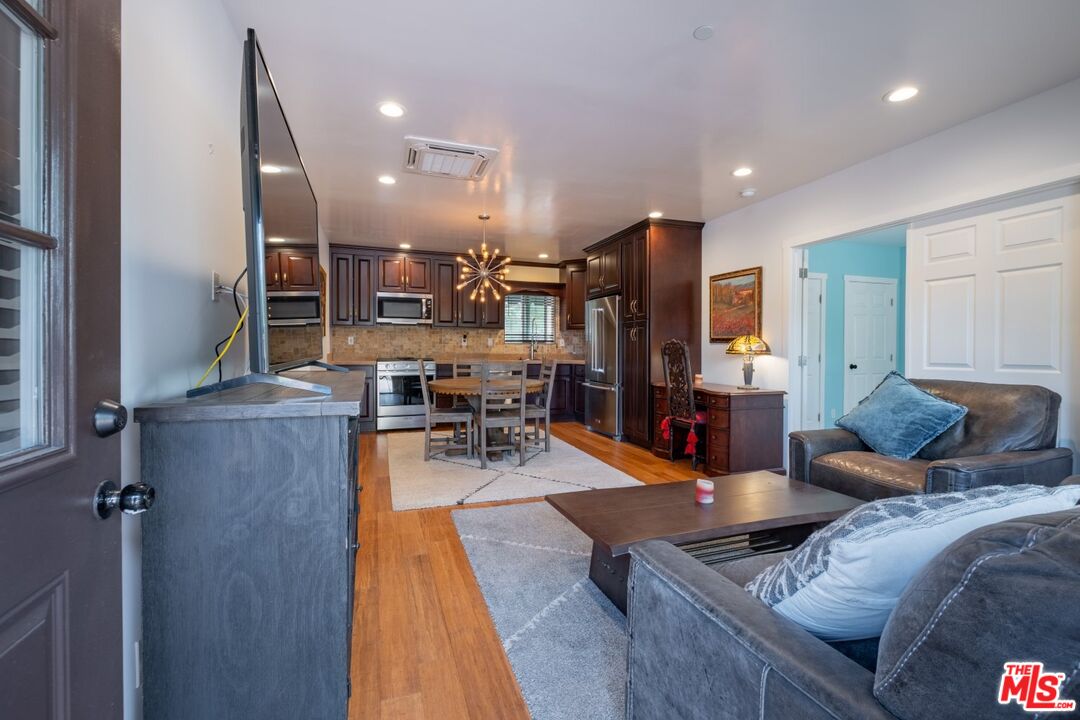 6820 Parsons Trail Tujunga, CA 91042 - Photo 12 of 36 a living room with lots of furniture and kitchen view