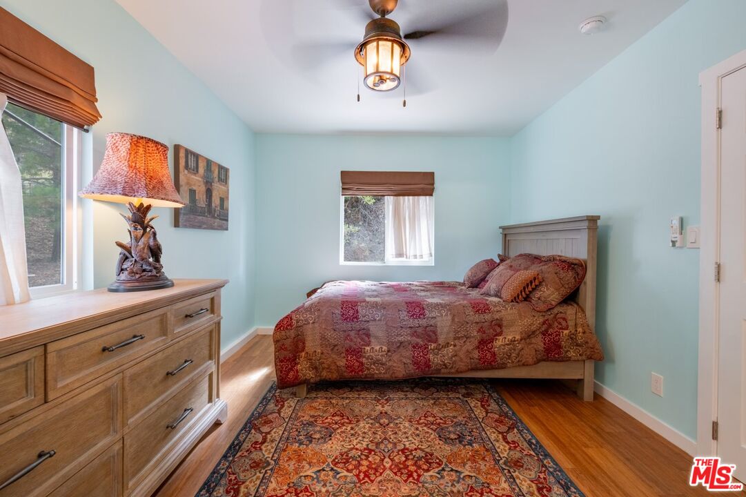 6820 Parsons Trail Tujunga, CA 91042 - Photo 23 of 36 a bed room with a bed and a window