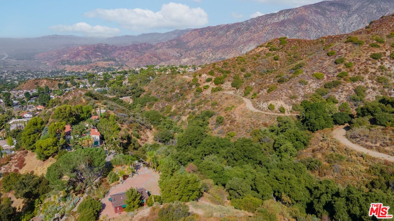 6820 Parsons Trail Tujunga, CA 91042 - Photo 34 of 36 a view of a houses with a lush green hillside