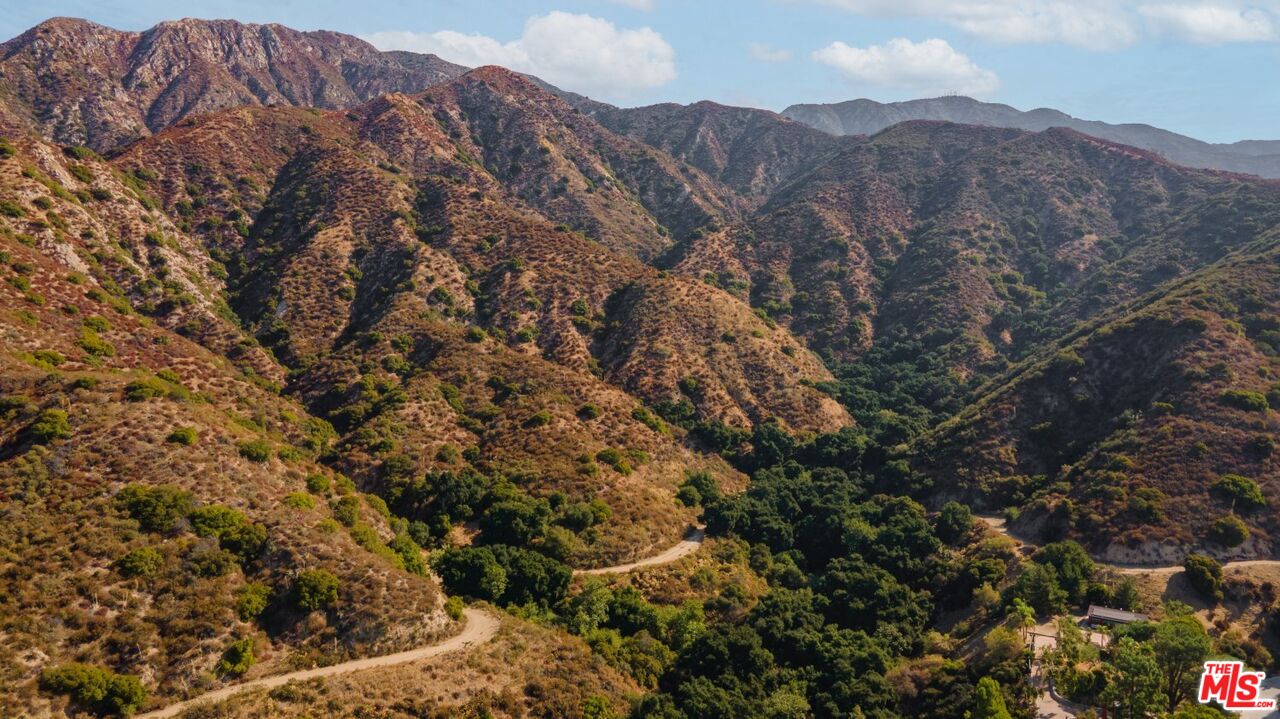 6820 Parsons Trail Tujunga, CA 91042 - Photo 35 of 36 a view of a dry yard with mountains in the background