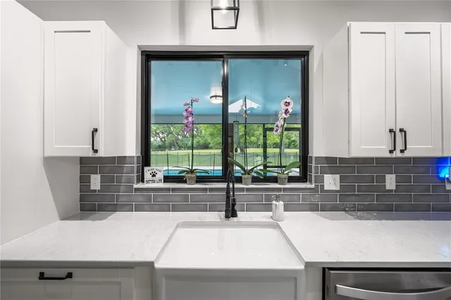 a room with a bed and a flat screen tv