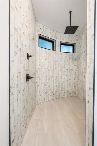 a living room with furniture a window and a table