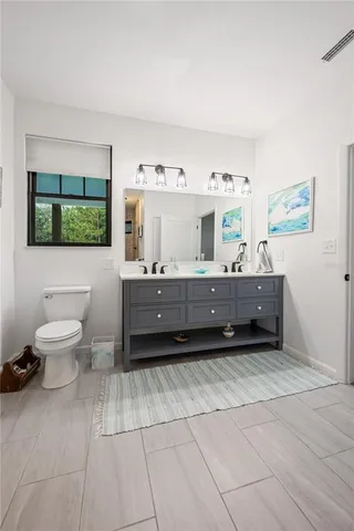 a kitchen with a table chairs and a refrigerator