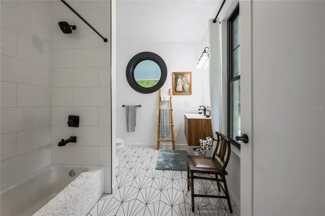 a view of two chairs in a balcony