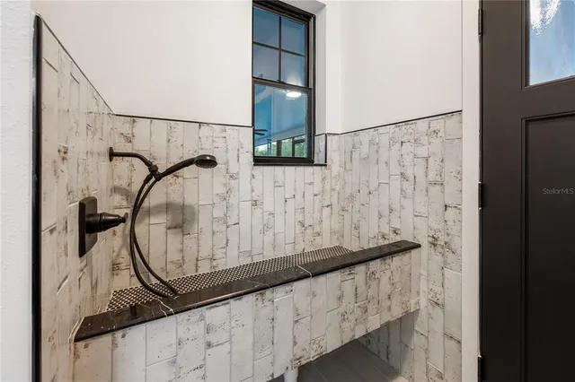 a bathroom with a double vanity sink and a mirror
