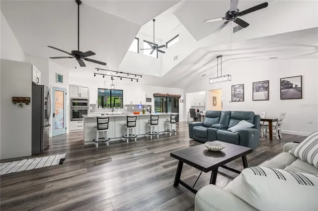 a kitchen with a refrigerator and microwave