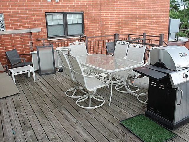 1623 North Halsted Street Chicago, IL 60614 - Photo 6 of 9 a view of a patio with table and chairs