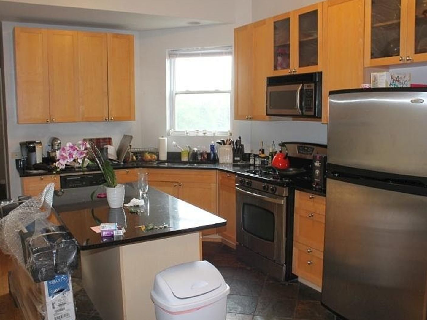 1623 North Halsted Street Chicago, IL 60614 - Photo 7 of 9 a kitchen with a sink stove and cabinets