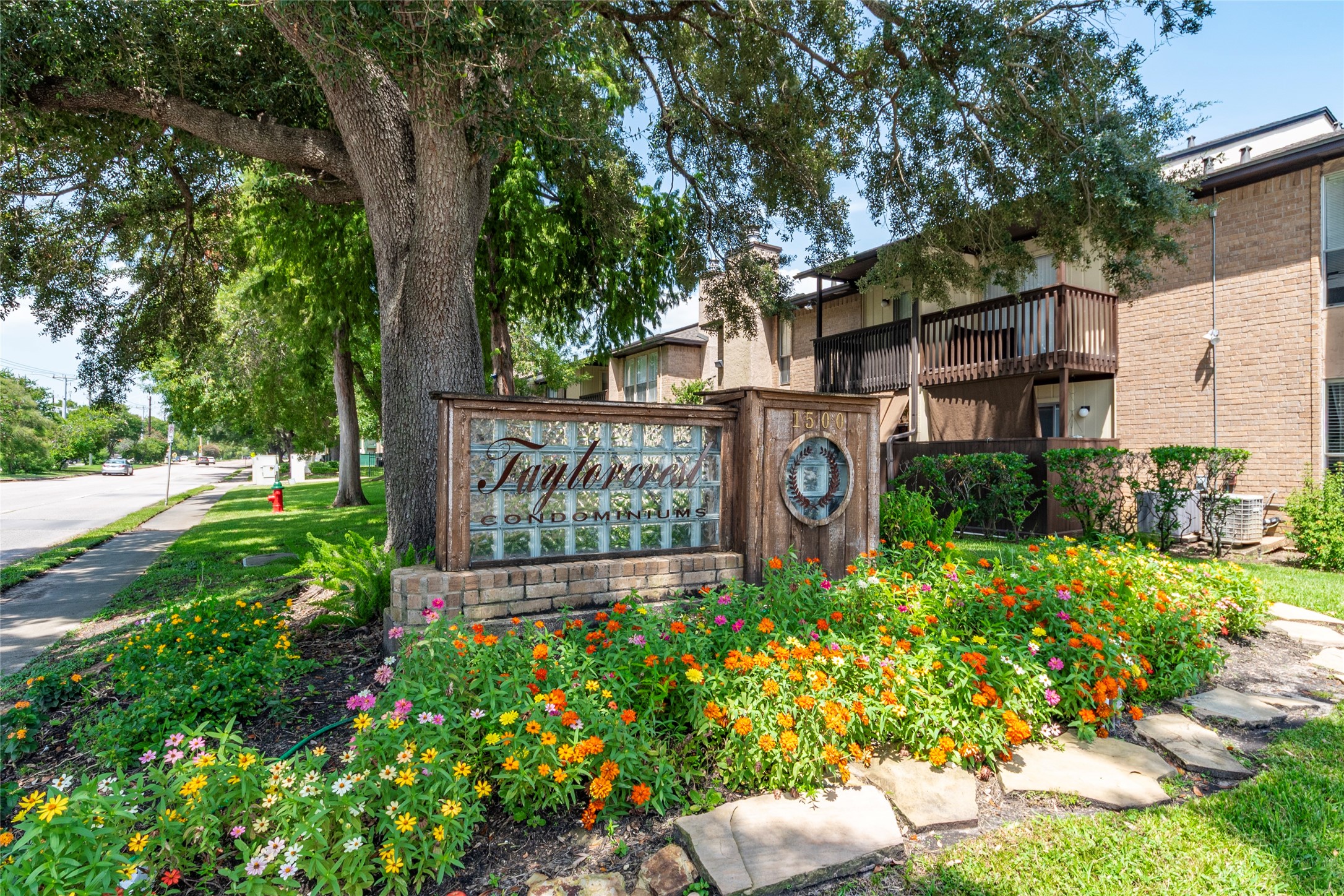 a sign that is in front of flowers