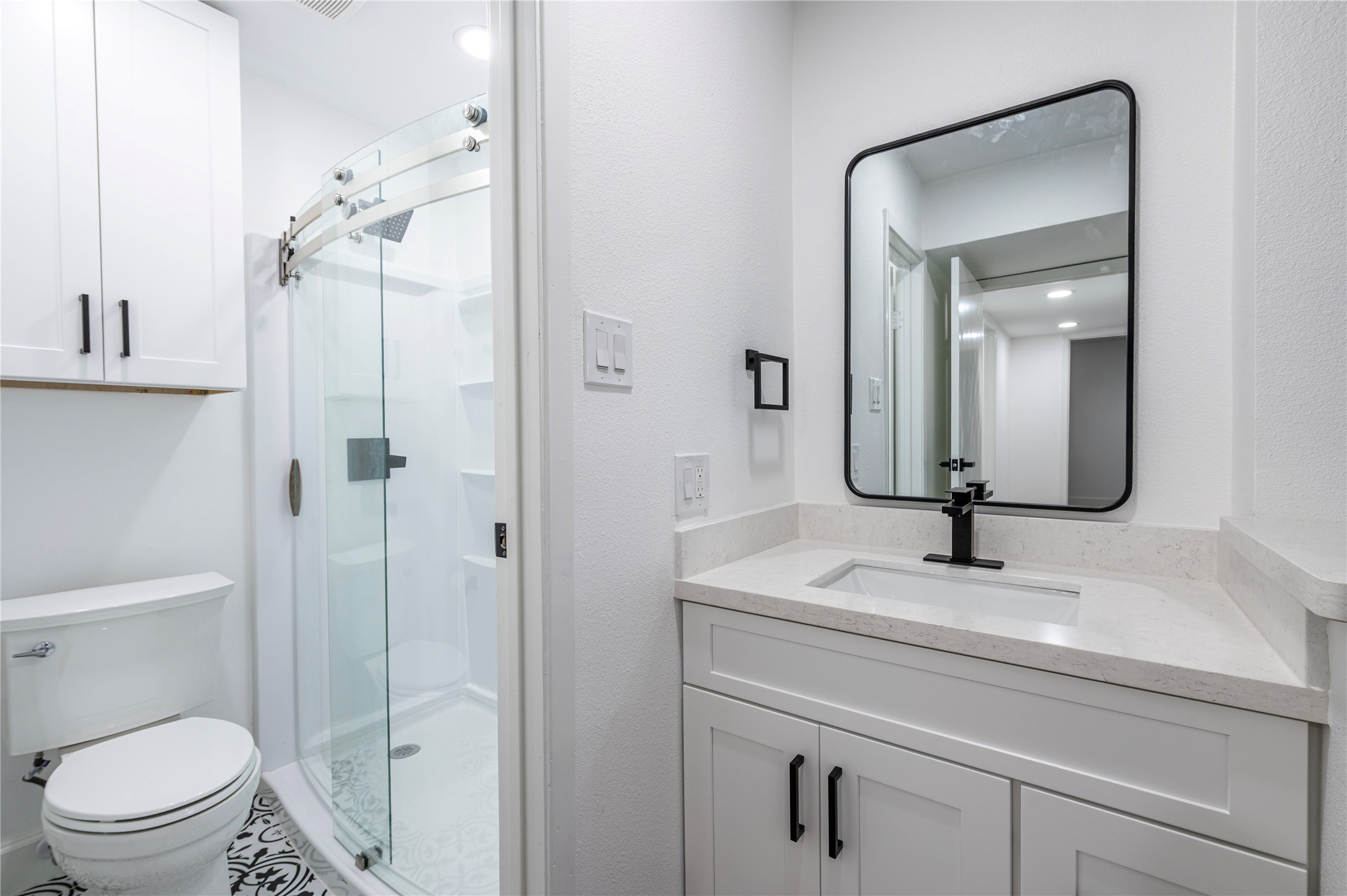 1500 Bay Area Boulevard, Unit 331 Houston, TX 77058 - Photo 18 of 27 a bathroom with a sink toilet vanity and shower