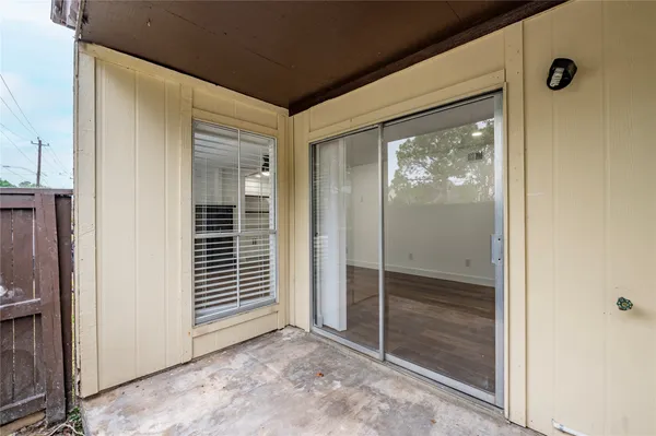 a view of a front door and wooden floor