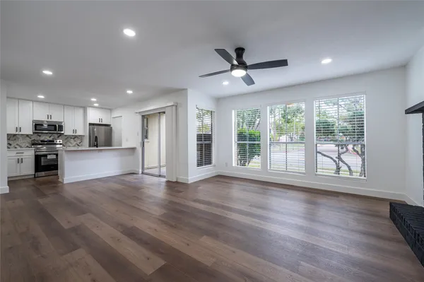 a view of kitchen with wooden floor and window