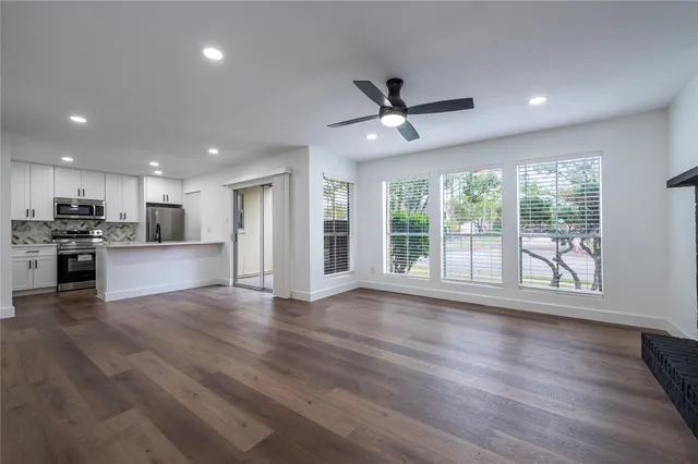 a view of kitchen with wooden floor and window