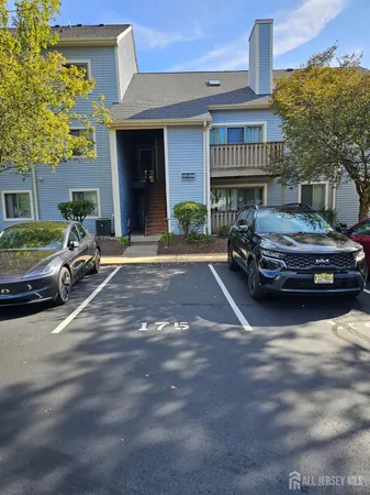 a car parked in front of a house