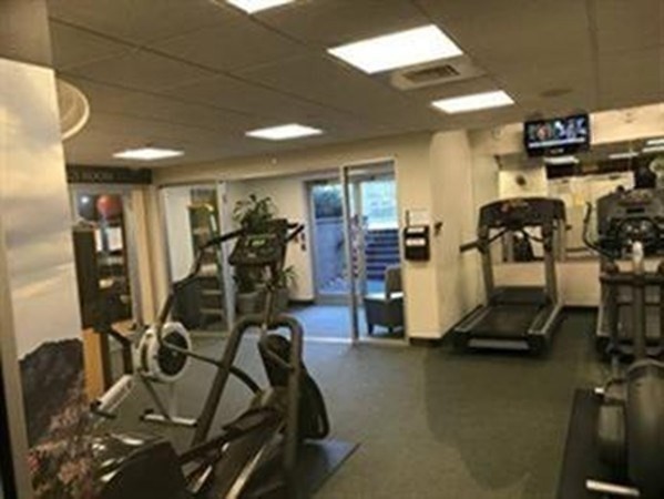 33 Pond Avenue, Unit 401 Brookline, MA 02445 - Photo 10 of 16 a view of a room with gym equipment