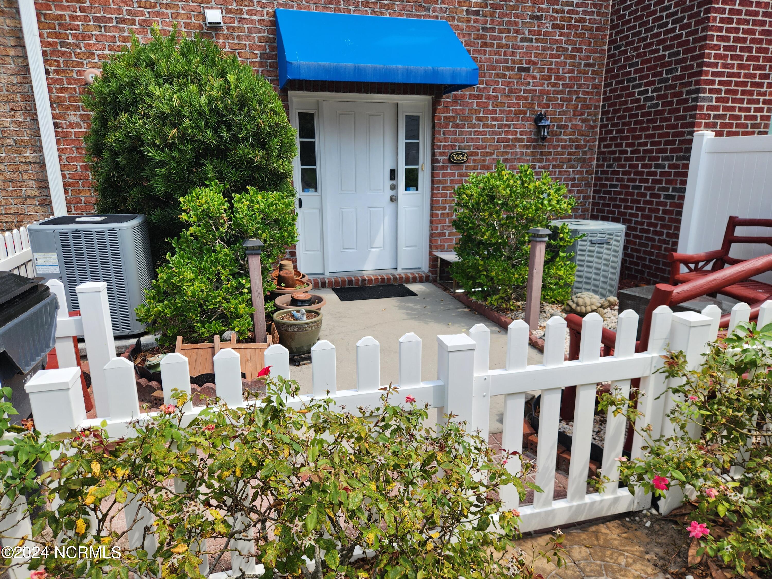 7645 High Market Street, Unit 4 Sunset Beach, NC 28468 - Photo 20 of 33 Rear Courtyard