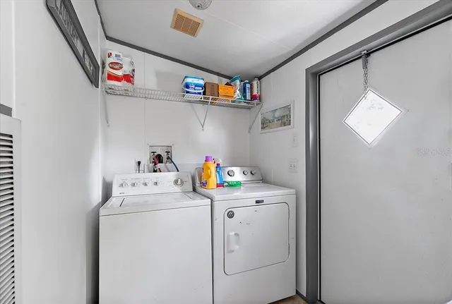 a utility room with dryer and washer