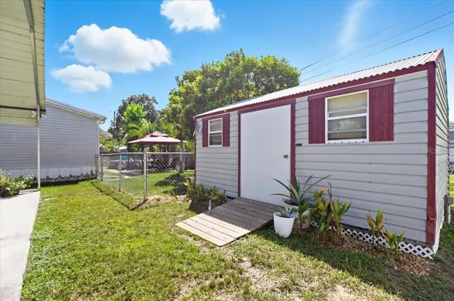 a view of a backyard with plants and a garden