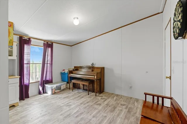 a bedroom with furniture and a window