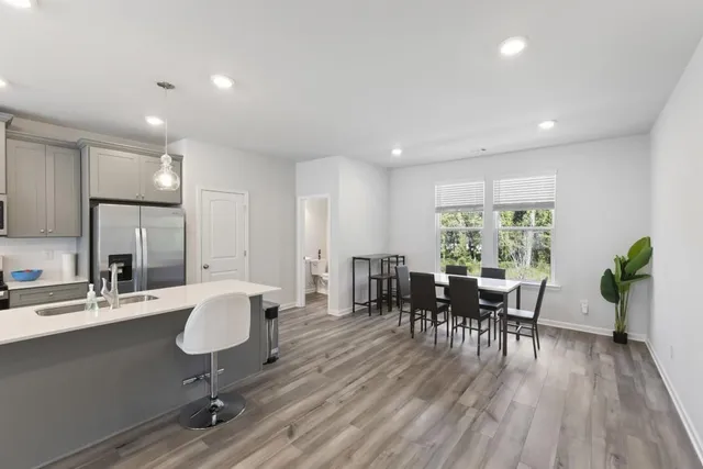 a view of a dining room with furniture window and wooden floor
