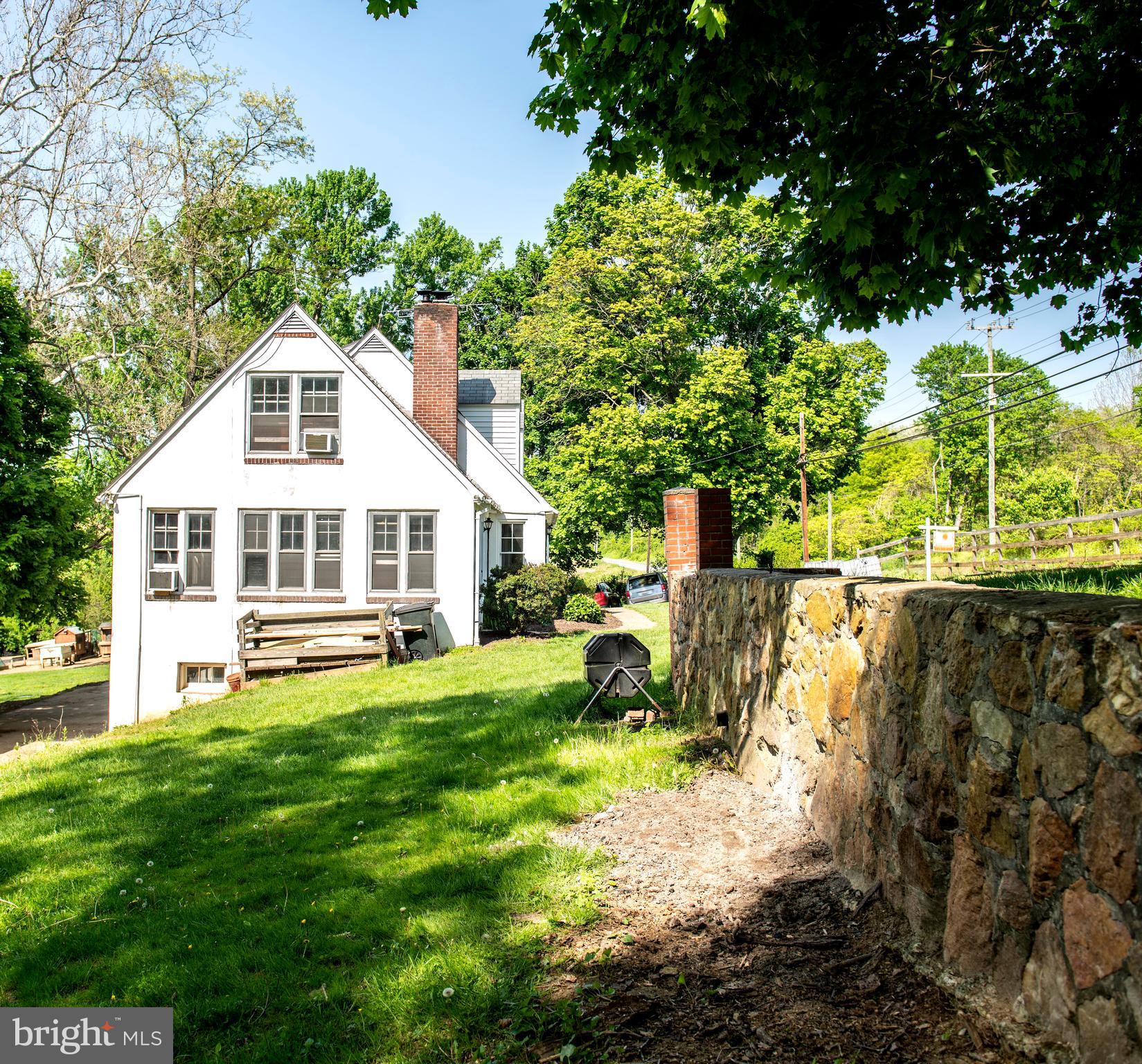 1800 White Hall Road White Hall, MD 21161 - Photo 5 of 52 Side view of home showing off old stone wall