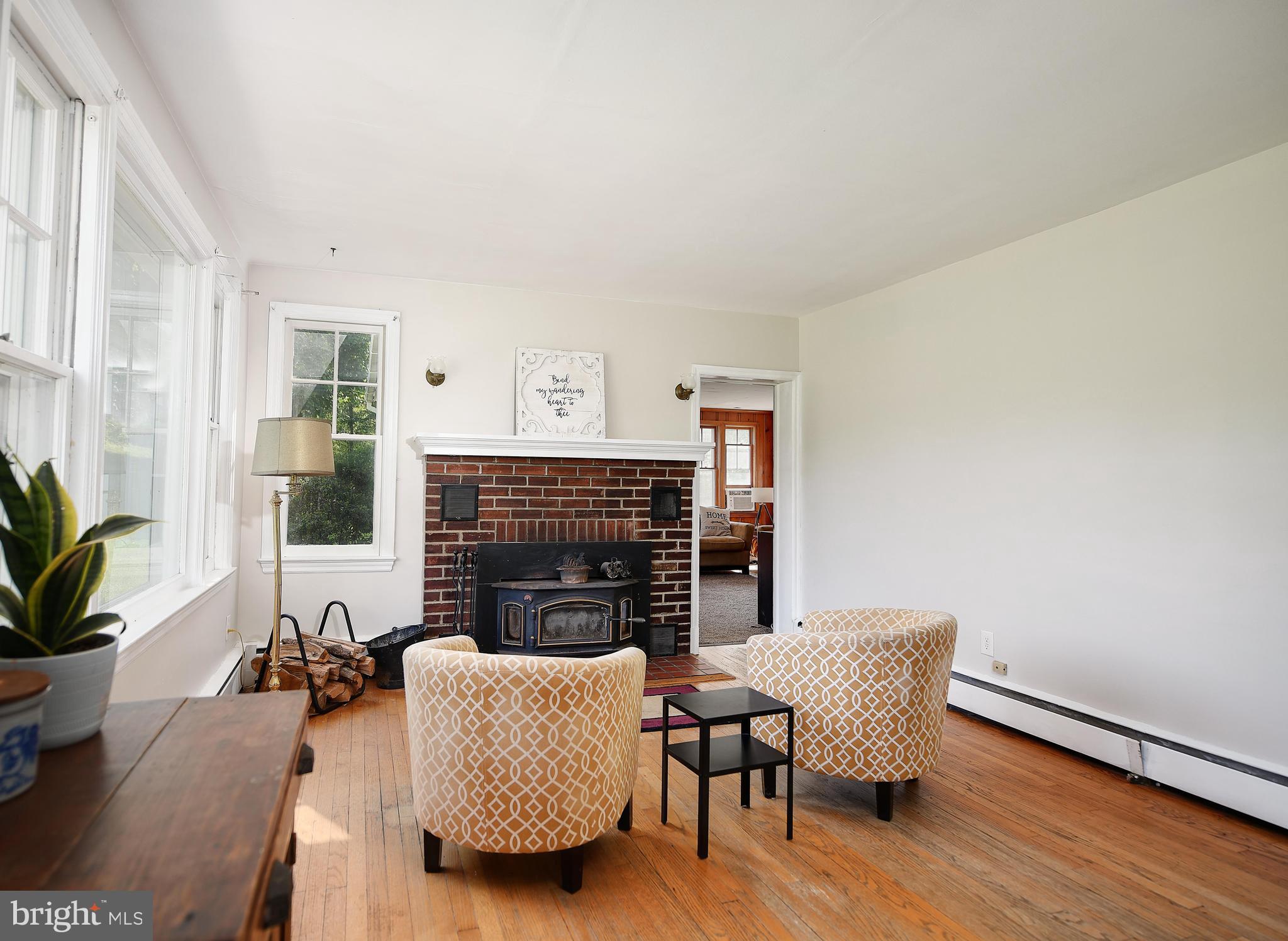 1800 White Hall Road White Hall, MD 21161 - Photo 8 of 52 Wood stove with brick surround