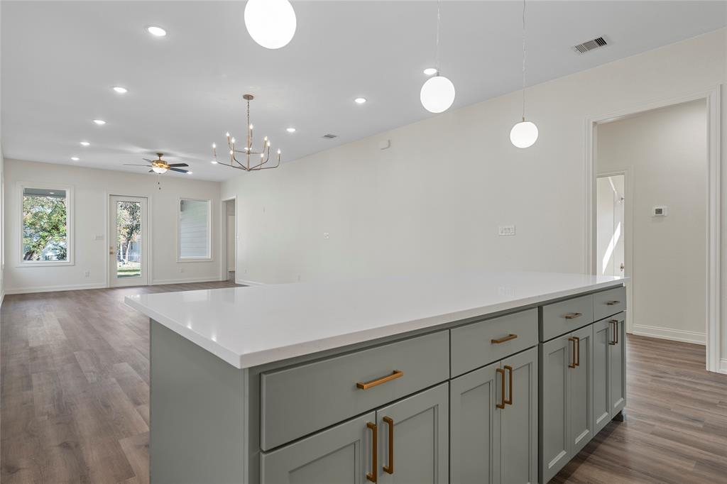 603 South Harrison Street West, TX 76691 - Photo 29 of 30 a view of an empty room with wooden floor and a window