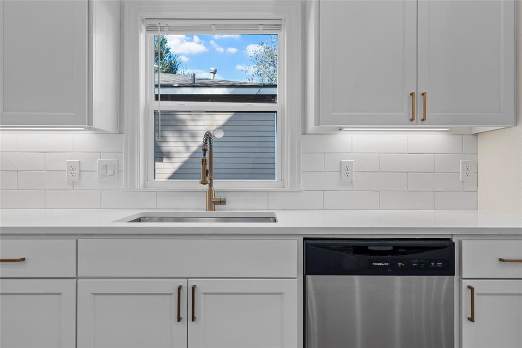 603 South Harrison Street West, TX 76691 - Photo 12 of 30 a kitchen with a sink and cabinets