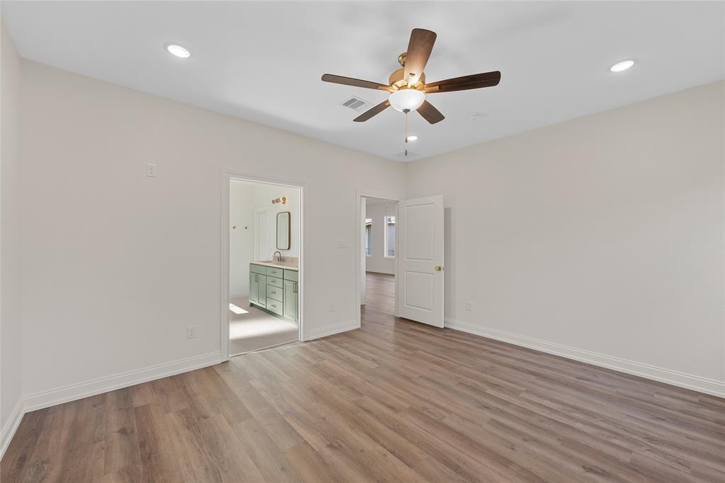 603 South Harrison Street West, TX 76691 - Photo 15 of 30 a view of an empty room with wooden floor and a ceiling fan