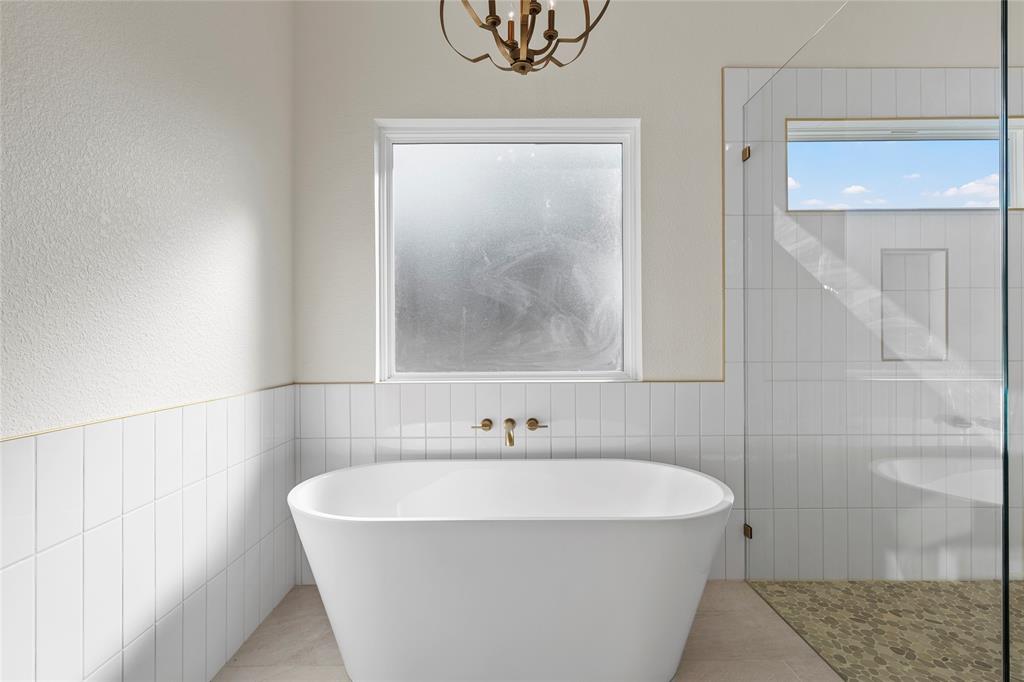 603 South Harrison Street West, TX 76691 - Photo 18 of 30 a white bath tub sitting next to a white sink