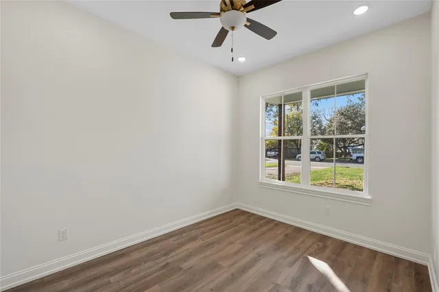 a bathroom with a granite countertop sink a toilet and a bathtub