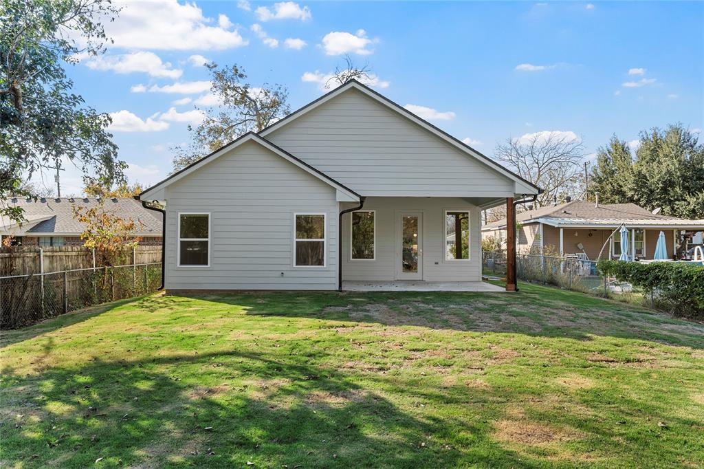 603 South Harrison Street West, TX 76691 - Photo 27 of 30 a view of a yard in front of a house with large trees