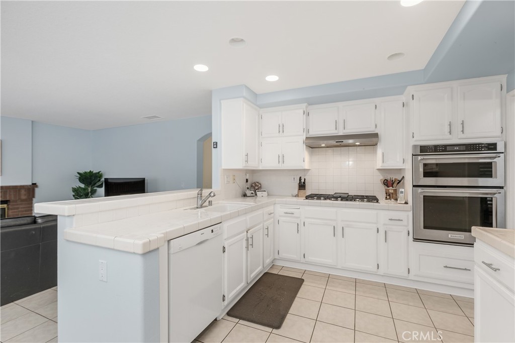 1874 Natalie Lane Riverside, CA 92506 - Photo 19 of 40 a kitchen with cabinets appliances and a counter space