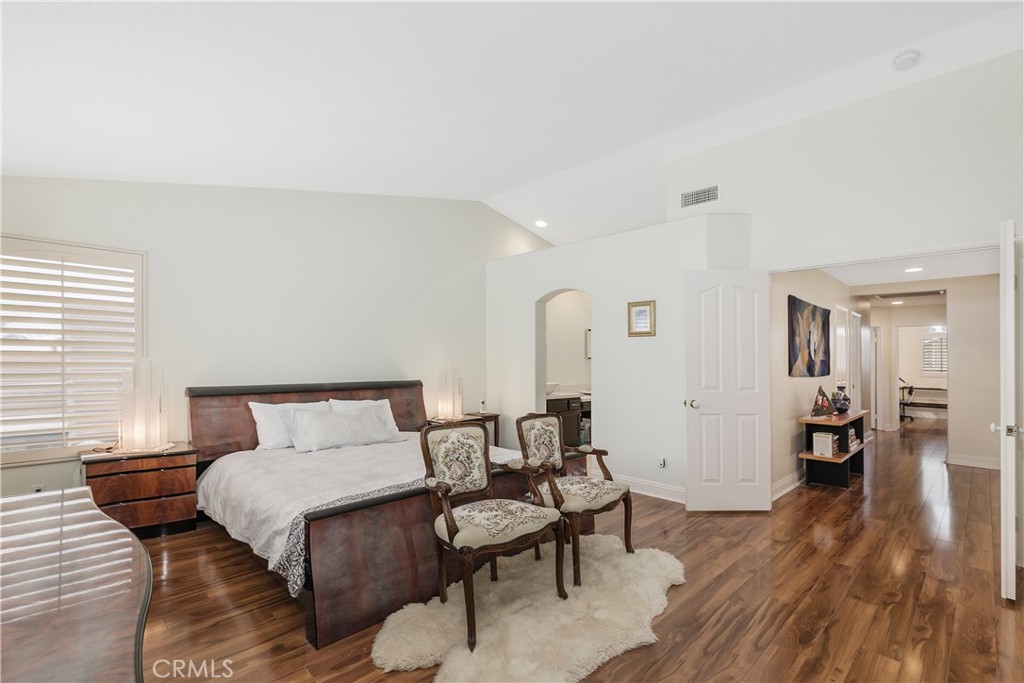 1874 Natalie Lane Riverside, CA 92506 - Photo 23 of 40 a bedroom with a bed and wooden floor